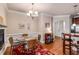 Bright dining area with glass table and wicker chairs, adjacent to the kitchen at 2300 Peachford Rd # 1209, Atlanta, GA 30338
