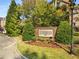 Community entrance with brick signage and landscaping at 2300 Peachford Rd # 1209, Atlanta, GA 30338