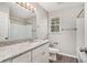 Updated bathroom with granite countertop and white cabinets at 3276 Marlanta Dr, Marietta, GA 30062