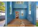 A wooden deck with a blue exterior wall and a red door at 281 Griffin Nw St, Atlanta, GA 30314