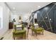 Bright living room features stylish armchairs and a view into the dining area at 1695 North Nw Ave, Atlanta, GA 30318