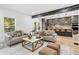 Open living area with modern sofas and coffee table, overlooking kitchen at 1695 North Nw Ave, Atlanta, GA 30318