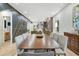 Modern dining room with long wood table and gray chairs at 1695 North Nw Ave, Atlanta, GA 30318