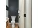 Modern, clean bathroom with a toilet and dark-colored wall at 1695 North Nw Ave, Atlanta, GA 30318
