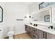 Modern bathroom with a double vanity and lighted mirror at 1695 North Nw Ave, Atlanta, GA 30318
