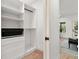 Spacious walk-in closet with built-in shelves and drawers at 1695 North Nw Ave, Atlanta, GA 30318