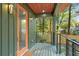 Charming front porch with orange door and wood deck, offering a relaxing outdoor space at 1695 North Nw Ave, Atlanta, GA 30318