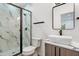 Modern bathroom with walk-in shower, floating vanity, and marble tile at 1695 North Nw Ave, Atlanta, GA 30318