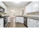 Kitchen with white cabinets, granite countertops, and stainless steel appliances at 6943 Fairway Trl, Austell, GA 30168