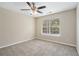 Bright bedroom with neutral walls, carpet flooring, and a large window at 6943 Fairway Trl, Austell, GA 30168
