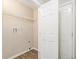 Laundry room with built-in shelving and vinyl flooring at 6943 Fairway Trl, Austell, GA 30168