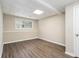 Finished basement room with vinyl flooring and a window at 6943 Fairway Trl, Austell, GA 30168