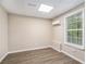 Spacious basement room with vinyl flooring and window at 6943 Fairway Trl, Austell, GA 30168