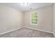 Spacious bedroom with neutral walls and carpet flooring at 6943 Fairway Trl, Austell, GA 30168
