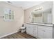 Bathroom boasts double vanity with granite countertop at 6943 Fairway Trl, Austell, GA 30168
