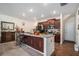 Modern kitchen with granite countertops and dark wood cabinets at 532 Ruths Dr, Woodstock, GA 30188