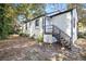 White brick house exterior with wooden stairs and a backyard at 3060 Washington Rd, Atlanta, GA 30344