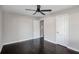 Well-lit bedroom with dark hardwood floors and ceiling fan at 3060 Washington Rd, Atlanta, GA 30344