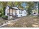 White brick ranch home with brown trim and covered porch at 3060 Washington Rd, Atlanta, GA 30344