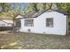 White brick ranch home with brown trim and covered porch at 3060 Washington Rd, Atlanta, GA 30344