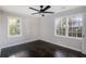 Spacious bedroom with dark hardwood floors and large windows at 3060 Washington Rd, Atlanta, GA 30344