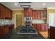 Kitchen features granite countertops and wood cabinets at 225 Asante Dr, Ellenwood, GA 30294