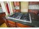 Island with gas cooktop and granite countertop at 225 Asante Dr, Ellenwood, GA 30294