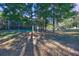 Wooded lot with tall trees and grass at 125 Sagamore Ct, Fayetteville, GA 30214