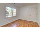 Hardwood floor bedroom with two large windows at 125 Sagamore Ct, Fayetteville, GA 30214