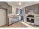 Modern kitchen with gray cabinets, stainless steel appliances, and quartz countertops at 125 Sagamore Ct, Fayetteville, GA 30214