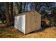 White storage shed in backyard provides extra storage at 1328 White Oak Se St, Conyers, GA 30013