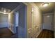Bright hallway with wainscoting, wood flooring, and updated doors at 1328 White Oak Se St, Conyers, GA 30013
