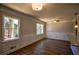 Spacious dining room with wainscoting, hardwood floors and large windows at 1328 White Oak Se St, Conyers, GA 30013