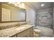 Renovated bathroom, granite countertop, bathtub and shower at 1328 White Oak Se St, Conyers, GA 30013