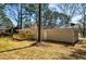 Rear view of a renovated home showcasing a new deck and private backyard at 1328 White Oak Se St, Conyers, GA 30013
