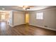 Open living area with hardwood floors and views into kitchen at 1328 White Oak Se St, Conyers, GA 30013