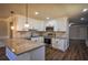 Modern kitchen featuring granite countertops, stainless steel appliances, and white cabinets at 1328 White Oak Se St, Conyers, GA 30013