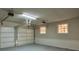 Attached garage with automatic door opener and extra storage at 1328 White Oak Se St, Conyers, GA 30013