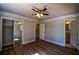 Spacious bedroom with mirrored closet doors and hardwood floors at 1328 White Oak Se St, Conyers, GA 30013