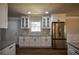 Modern kitchen with white cabinets, granite countertops, and stainless steel appliances at 1328 White Oak Se St, Conyers, GA 30013