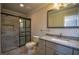 Updated bathroom with granite countertop and walk-in shower at 1328 White Oak Se St, Conyers, GA 30013