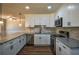 Updated kitchen with white cabinets, granite countertops, and stainless steel appliances at 1328 White Oak Se St, Conyers, GA 30013