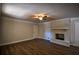 Bright living room featuring hardwood floors, fireplace and neutral walls at 1328 White Oak Se St, Conyers, GA 30013