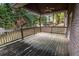 Wooden deck with covered area and wooded views at 3598 Brock Rd, Duluth, GA 30096