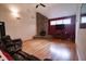 Gathering room boasts hardwood floors, stone fireplace, and high ceilings at 3598 Brock Rd, Duluth, GA 30096
