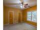 Spacious bedroom with neutral walls, ceiling fan, and carpet at 3598 Brock Rd, Duluth, GA 30096