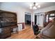 Home office with hardwood floors, built-in shelving and views to Gathering room at 3598 Brock Rd, Duluth, GA 30096