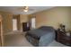 Spacious bedroom with carpeted floor, ceiling fan, and ample closet space at 3598 Brock Rd, Duluth, GA 30096