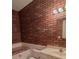 Bathroom with brick feature wall and white vanity at 3598 Brock Rd, Duluth, GA 30096