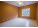 Spacious bedroom with neutral walls, ceiling fan, and a window at 3598 Brock Rd, Duluth, GA 30096